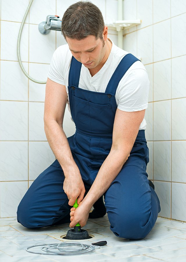 plumber_unclogging_drain